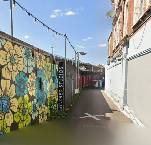 Entrance to Aura Framing studio at Kindred Studios